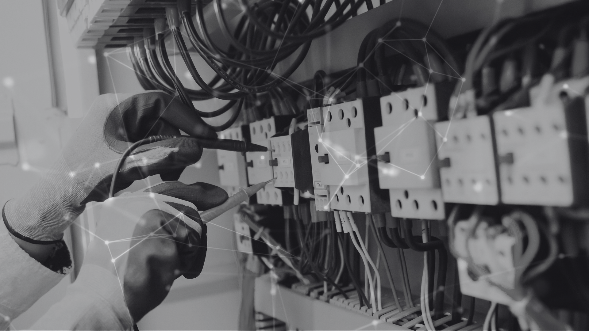 An electrical engineer working on wires